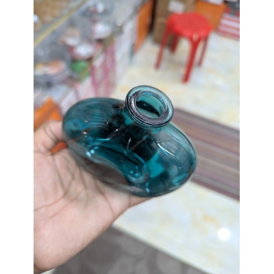 Picture of Elegant Handcrafted Teal Blue Recycled Glass Vase with Organic Bulbous Shape and Lipped Opening, Perfect Eco-Friendly Mediterranean Style Decorative Flower Bottle for Modern Sustainable Home Decor Accents and Unique Artisanal Gifting.-Multicolor