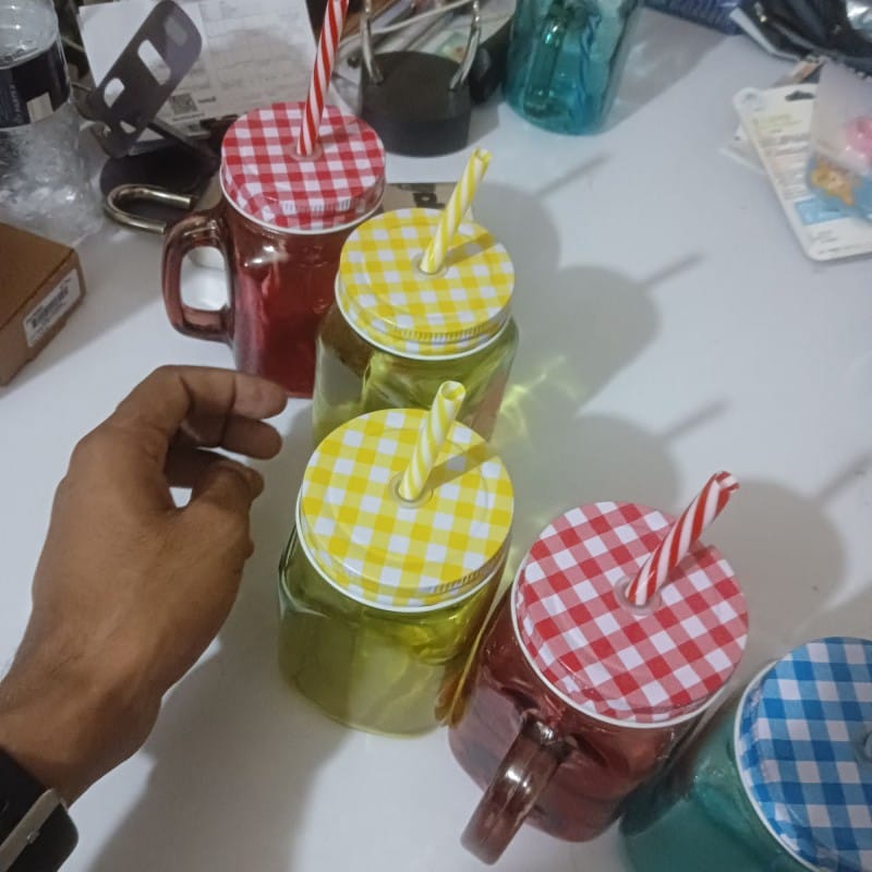 Picture of 1pcs blue glass Mason jar mug with a handle, a checkered lid, and a striped straw, designed with print print body for drinking beverages. -Blue