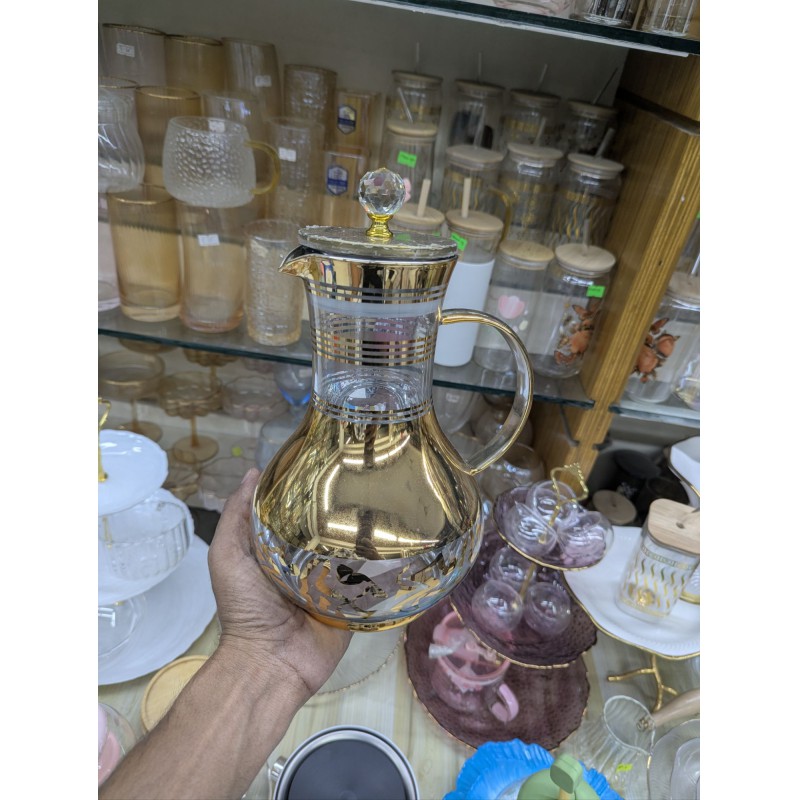 Picture of Premium luxury golden glass jug for dining table stylish 1700ml capacity heat resistant borosilicate glass water pitcher with lid and crystal knob perfect for serving cold juice tea and beverage items.-Gold