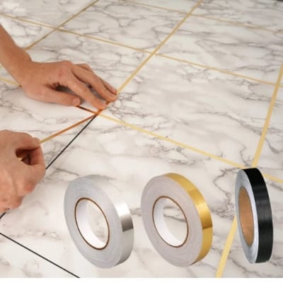 Picture of Tile Gap Foil Line Tape 50M Gold | Self Adhesive Waterproof Seam Sticker | Mirror Finish Decorative Tape for Wall, Kitchen, Cabinet & Floor 