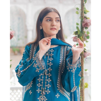 Picture of bright red stitched 3-piece cotton suit featuring heavy sequence and embroidery work, similar to designs available from