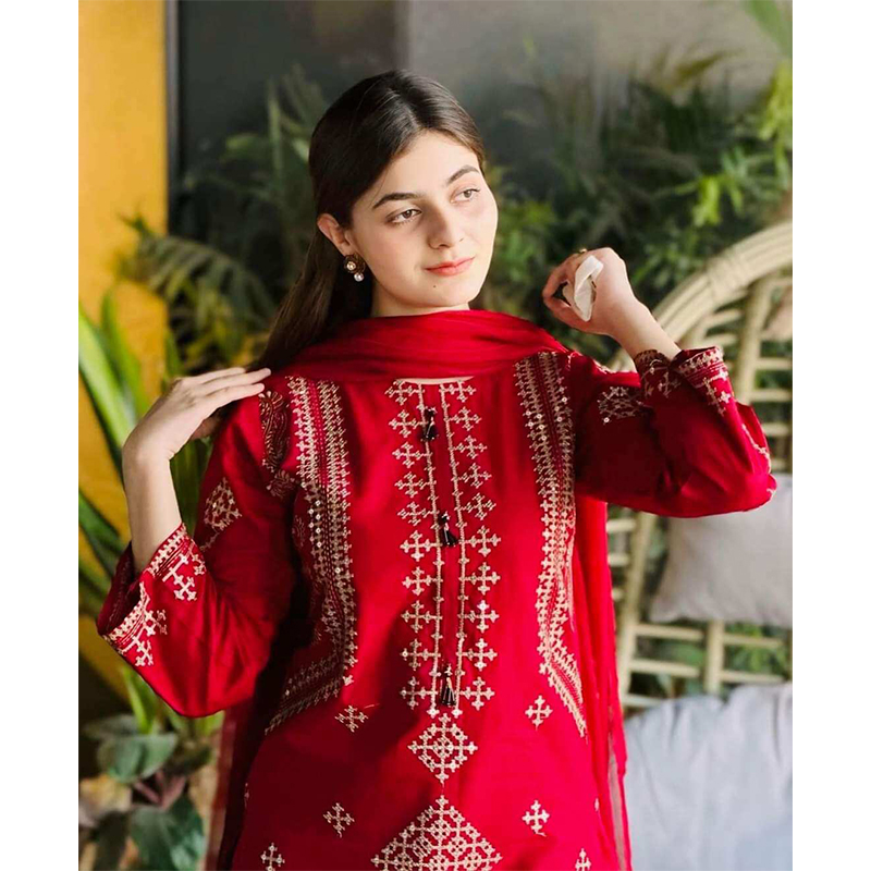 Picture of bright red stitched 3-piece cotton suit featuring heavy sequence and embroidery work, similar to designs available from