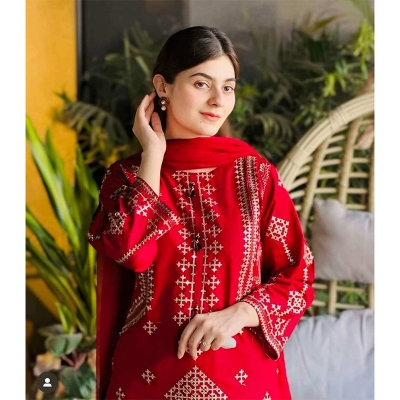 Picture of bright red stitched 3-piece cotton suit featuring heavy sequence and embroidery work, similar to designs available from